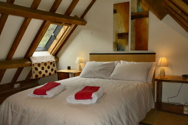 Sloping roof and beams in the bedroom