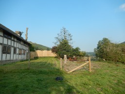 The back of Squire Cottage showing the new fence